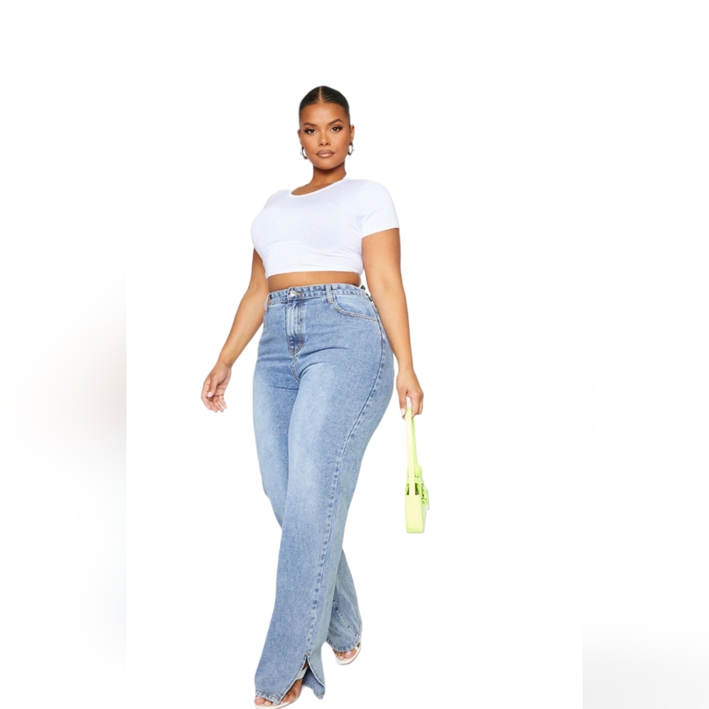 Pretty Little Thing size 12 mid blue washed jeans.